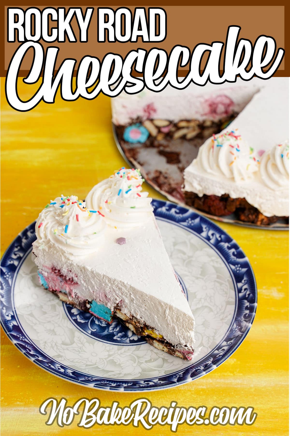 no-bake cheesecake slice on a plate with text which reads Rocky Road Cheesecake