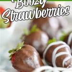 plate of chocolate strawberries with text which reads chocolate covered boozy strawberries