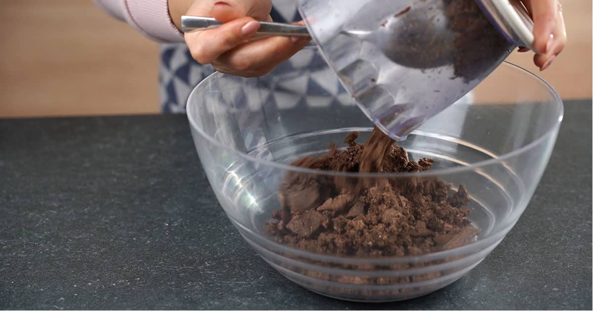 in-process step of making double chocolate champagne truffles by combining ingredients in a bowl