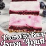 yogurt and berry breakfast bars on a marble plate with text which reads macerated berry frozen yogurt bars
