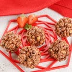 rocky road popcorn balls on a red plate