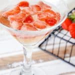 glass of champagne and strawberry champagne jello
