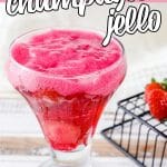 glass of strawberry jello champagne with text which reads strawberry champagne jello