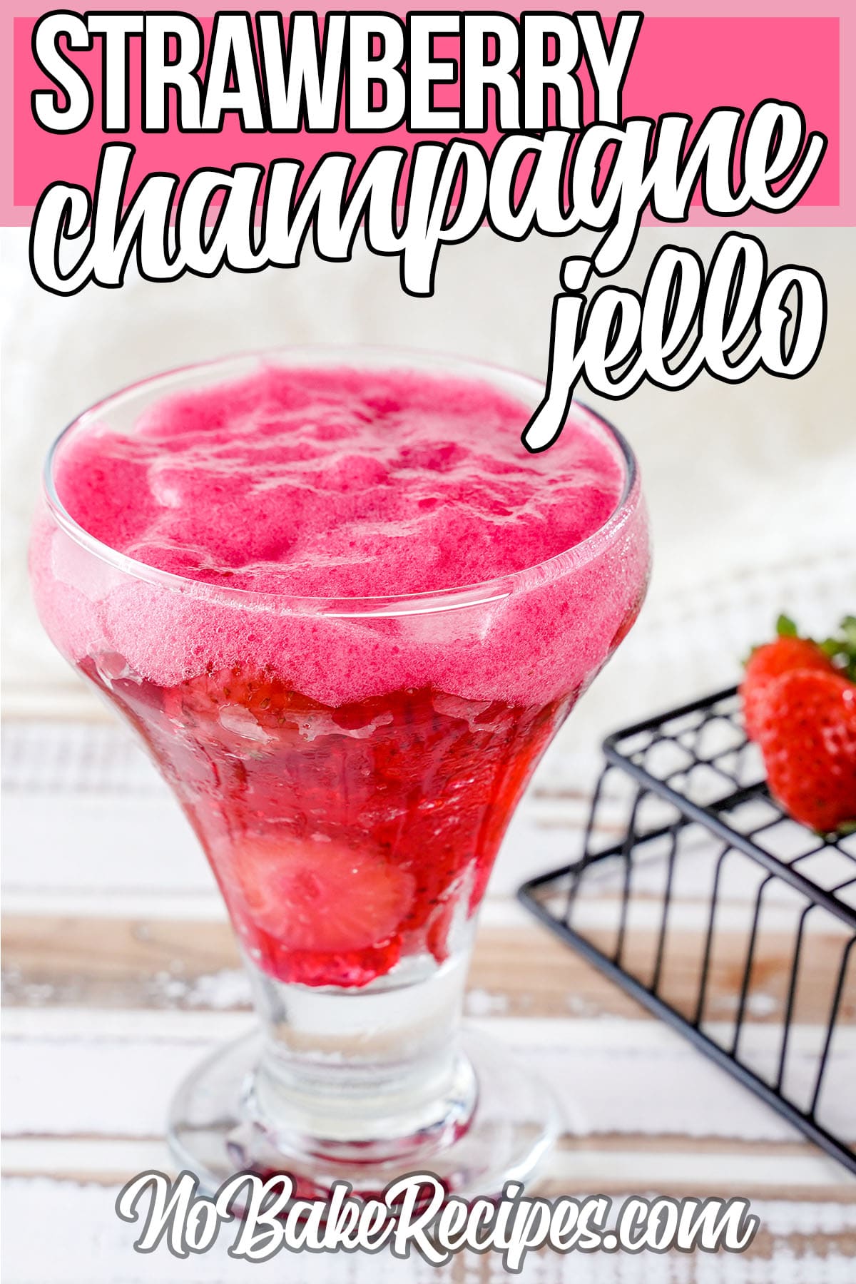 glass of strawberry jello champagne with text which reads strawberry champagne jello