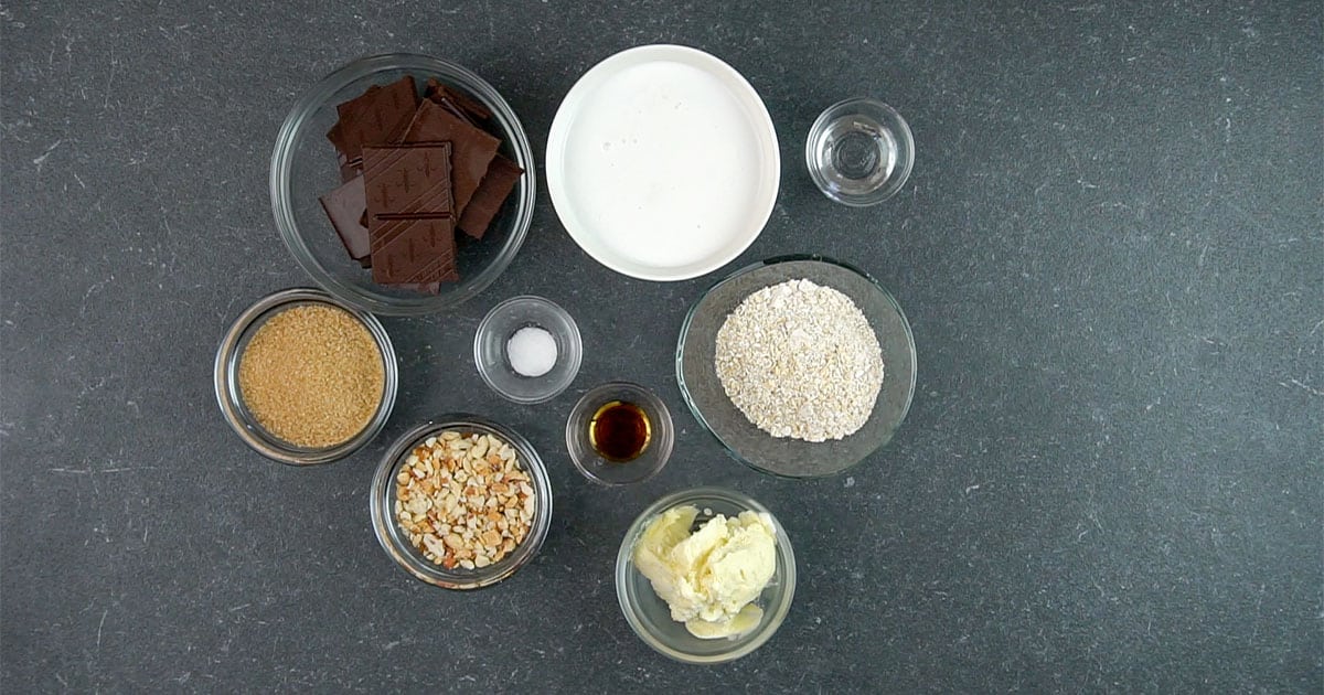 bowls of various ingredients to make Snickers Ice Cream Bars