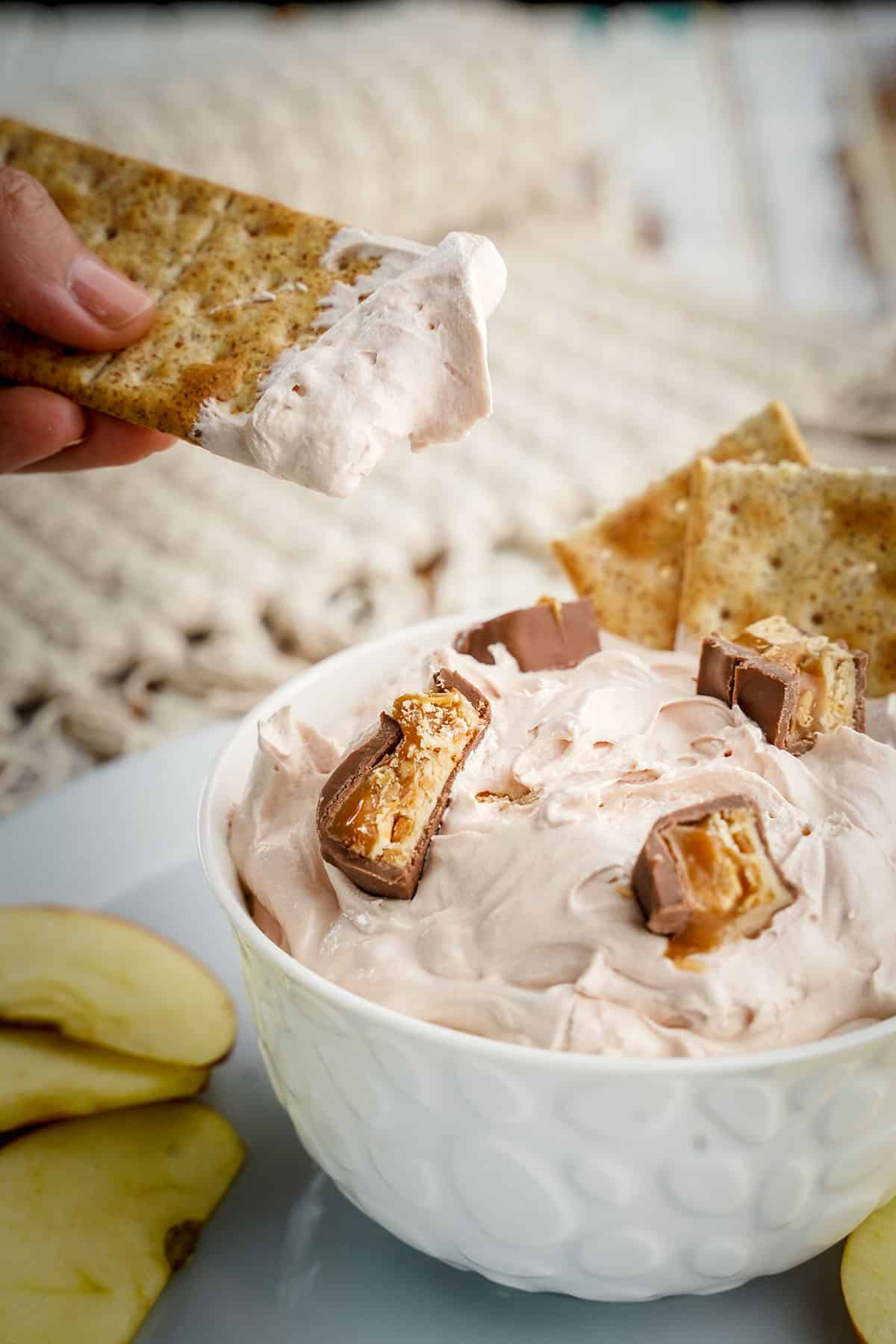 Snickers dip in a bowl on a table