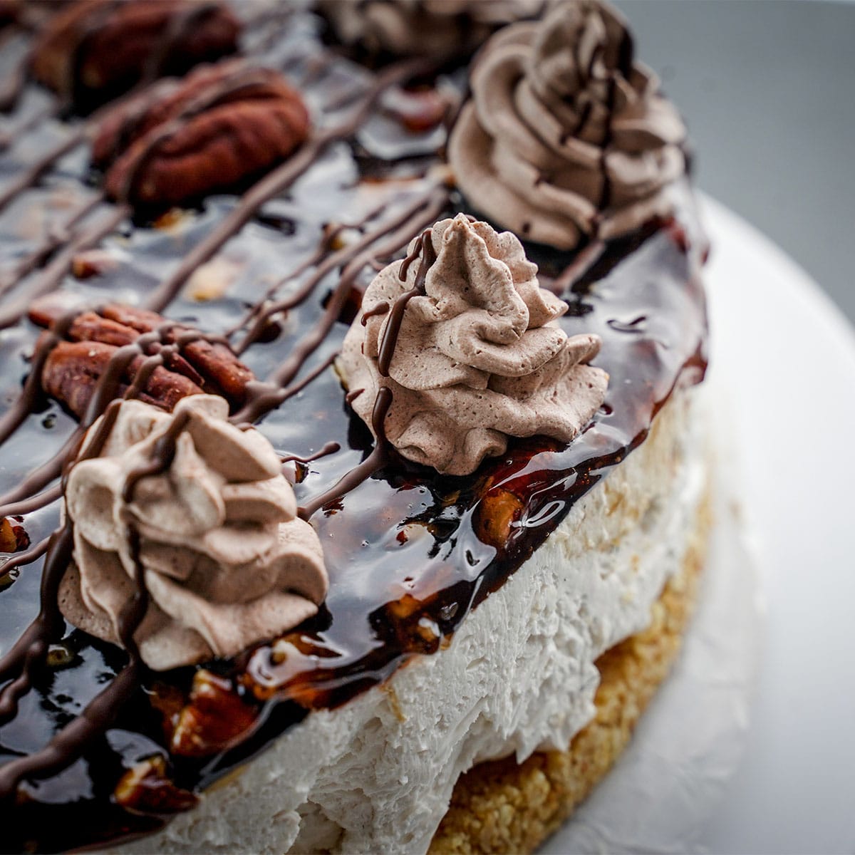 closeup view of chocolate caramel pecan cheesecake no-bake style