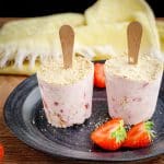 easy strawberry cheesecake flavored popsicles on a plate