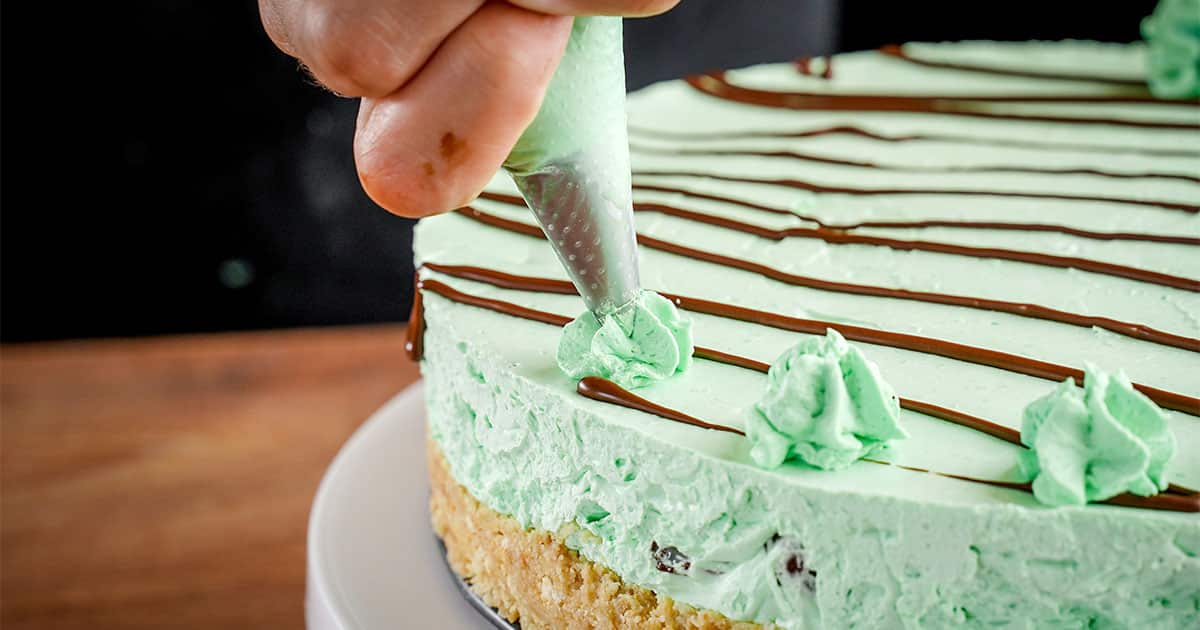 adding decorations to Andes Mint Cheesecake