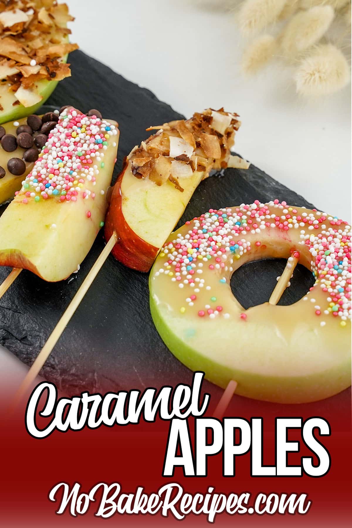 closeup of candy apples on a plate with text which reads caramel apples