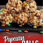 stacked caramel popcorn balls on a plate with text which reads popcorn balls