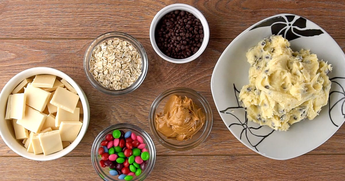 bowls of ingredients to make monster cookie dough bark