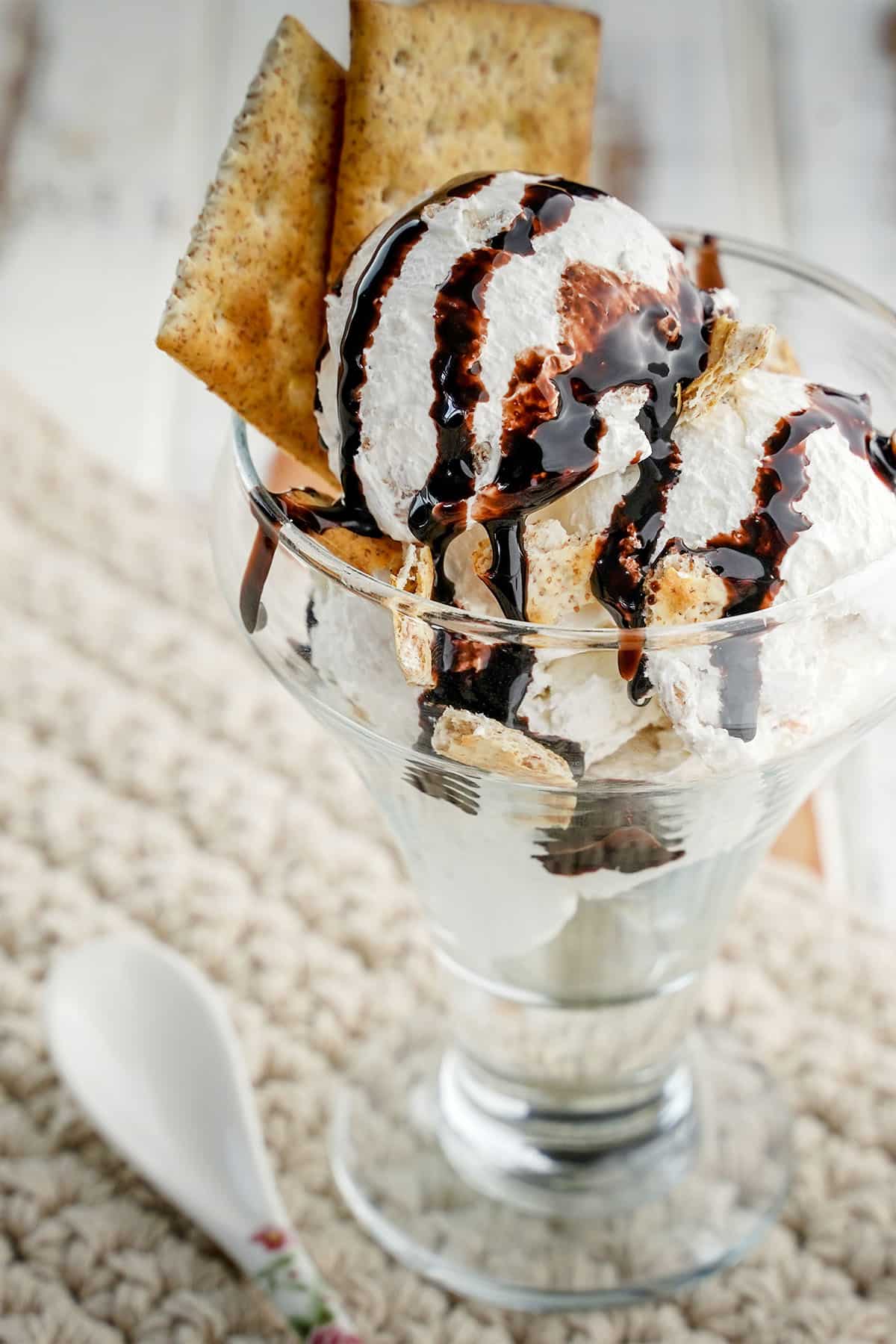 s'mores ice cream in a bowl with chocolate drizzle