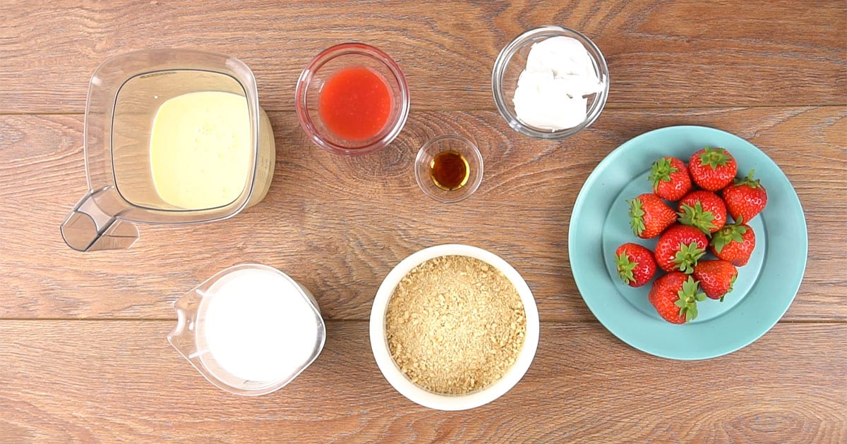 bowls of ingredients set out to make strawberry cheesecake ice cream