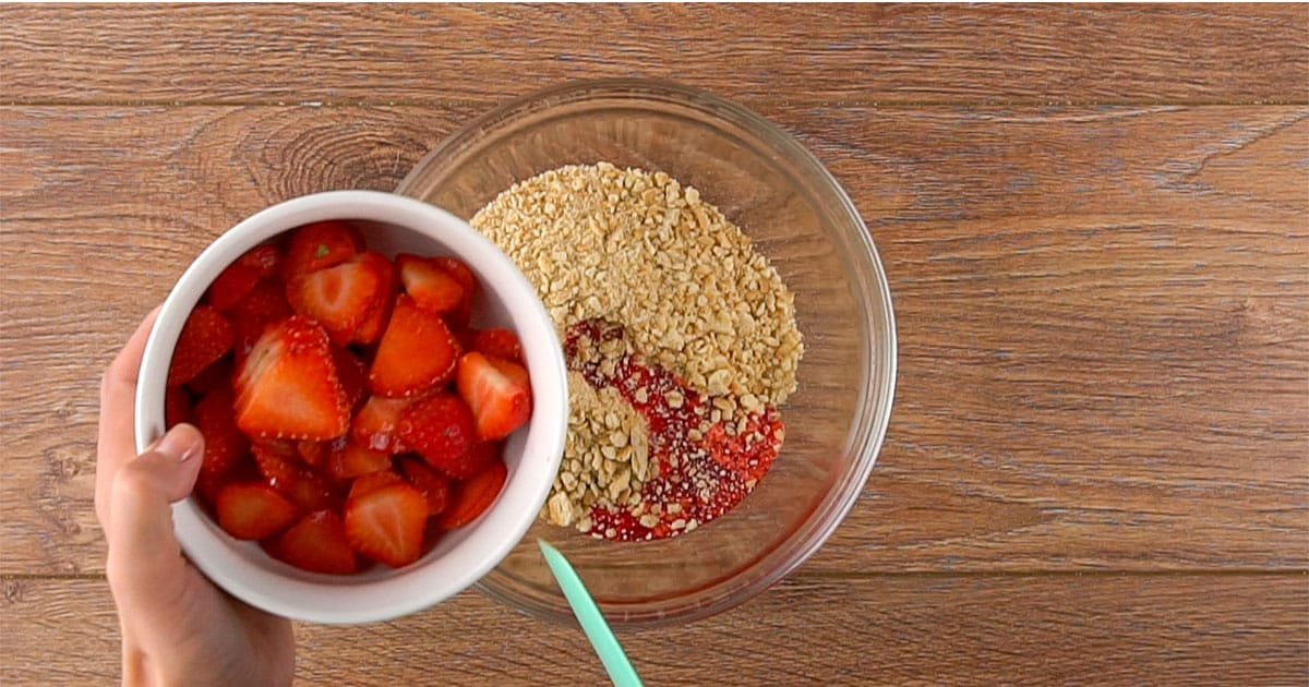 Add juice of strawberries to crumble mixture.