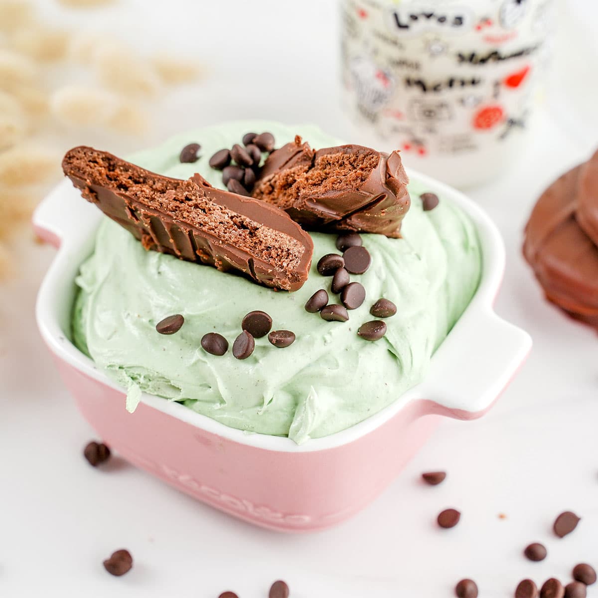 top look at Thin Mint cheesecake dip in pink dish.